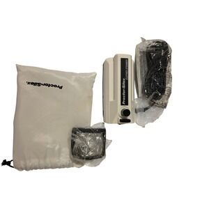 Proctor Silex Travel Clothes Steamer Dual Voltage Portable Handheld White Black